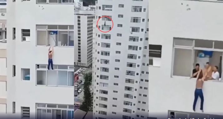 Mulher escorrega e fica pendurada em prédio ao tentar limpar janela