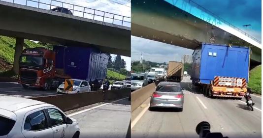Carreta com carga excedente ‘entala’ em viaduto na rodovia Fernão Dias